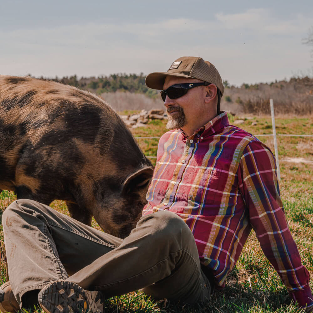 Portrait of Farmer John, Co-founder of Singing Pastures